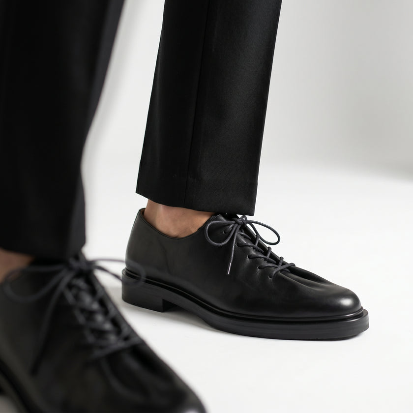 The Pietra Noir Signature Handcrafted Black Leather Contemporary Round-Toe Oxford-Inspired formal shoes for Men
