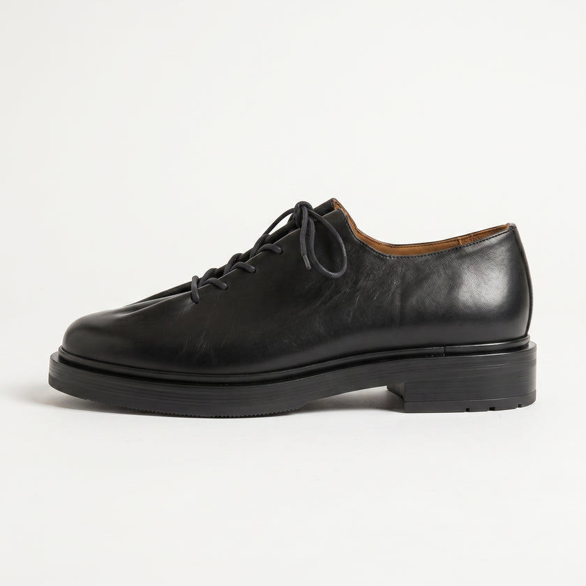 The Pietra Noir Signature Handcrafted Black Leather Contemporary Round-Toe Oxford-Inspired formal shoes for Men