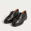 The Pietra Noir Signature Handcrafted Black Leather Contemporary Round-Toe Oxford-Inspired formal shoes for Men