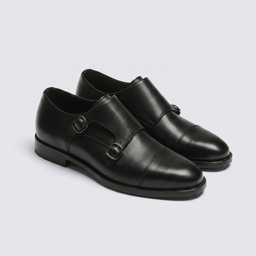 The Maison Noir Handcrafted Leather Double Monk Straps with Buckle Detailing and a Sleek Cap-Toe Silhouette for Men