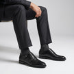 The Maison Noir Handcrafted Leather Double Monk Straps with Buckle Detailing and a Sleek Cap-Toe Silhouette for Men