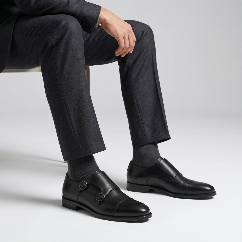 The Maison Noir Handcrafted Leather Double Monk Straps with Buckle Detailing and a Sleek Cap-Toe Silhouette for Men