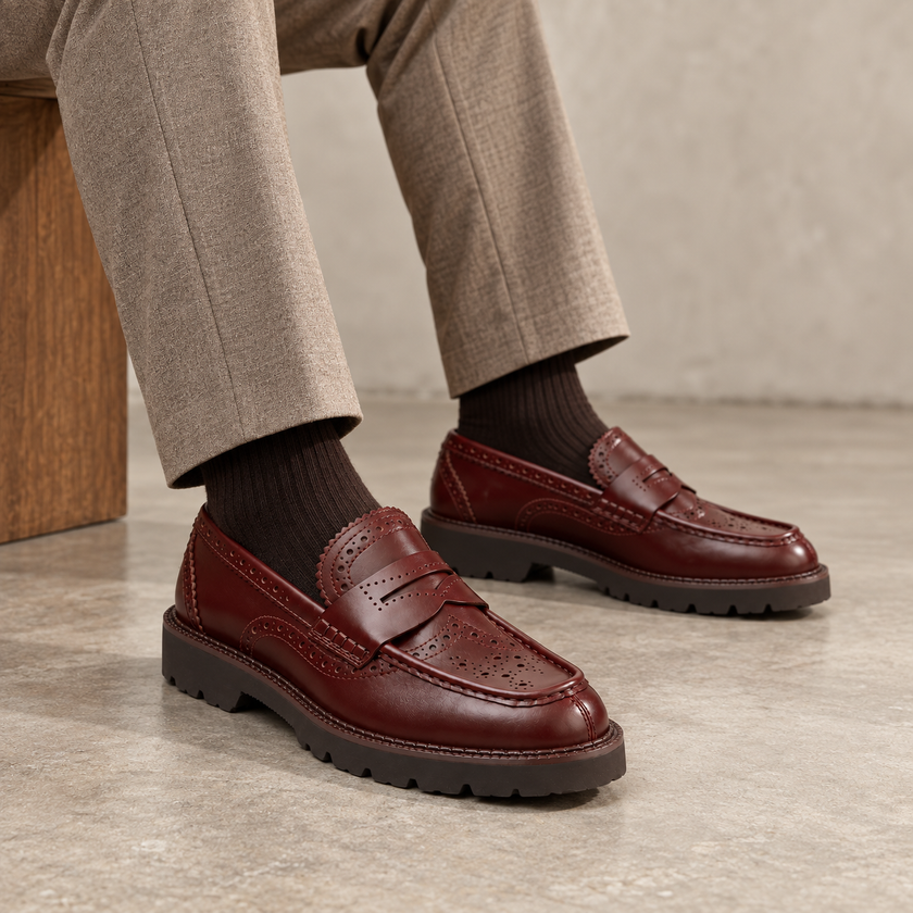 The Valenor Handcrafted Burgundy Leather Brogue Detailing, Refined Moc-Toe Silhouette & Polished Heritage Finish Penny Loafers
