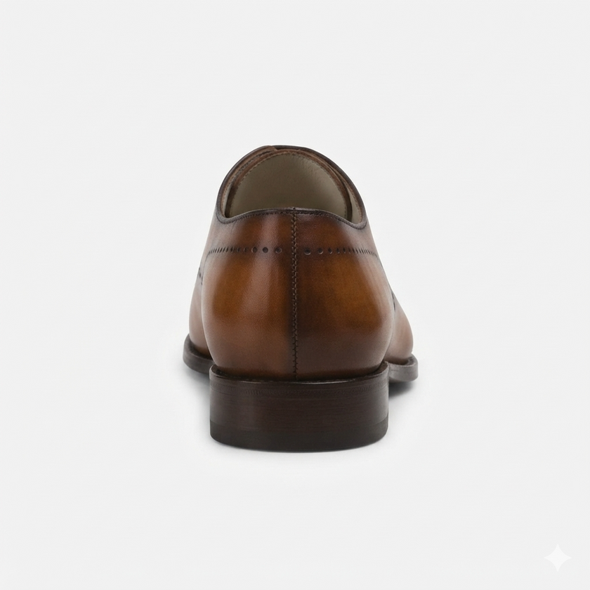 The Aurelius Milano Handcrafted Leather Wingtip Oxford Shoes for Men with Refined Brogue Detailing and Rich Cognac Patina