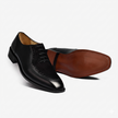 The Milano Prestige Black Leather Oxfords with Refined Brogue Perforations, Elegant Lace Up Styling and Classic Leather Sole for Men